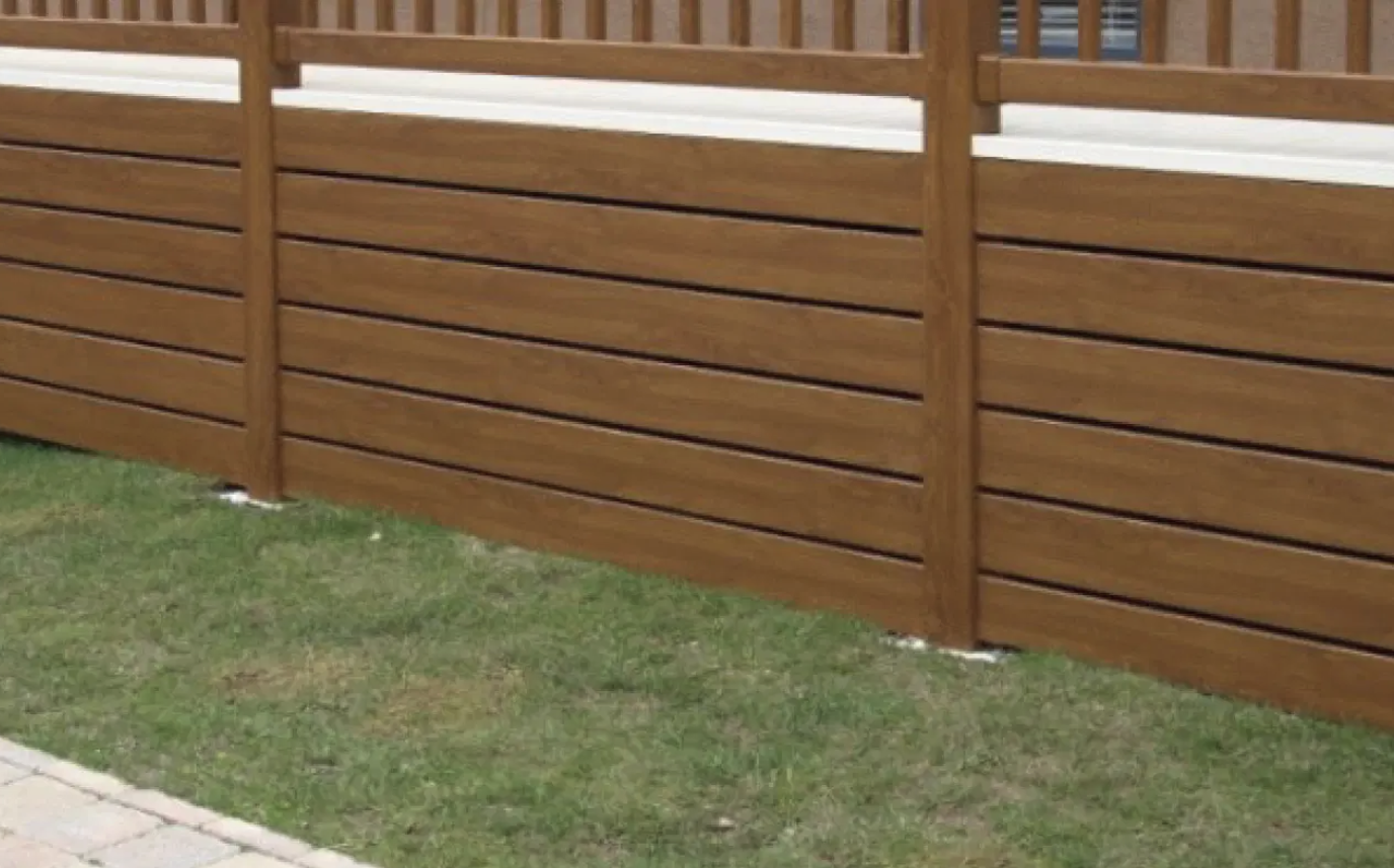 Brown composite skirting panels and posts fitted around a parkhome
